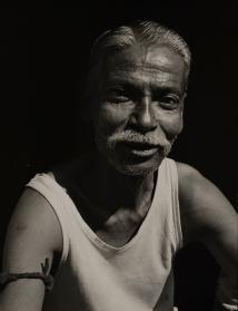 Close-up portrait of the wig maker, India
