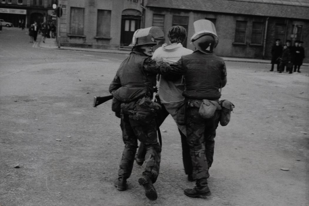 Battered and bleeding youth carried off by the police, Londonderry, Northern Ireland